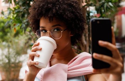 woman taking selfie for online dating app